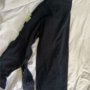 Black Shirt with Green Accents